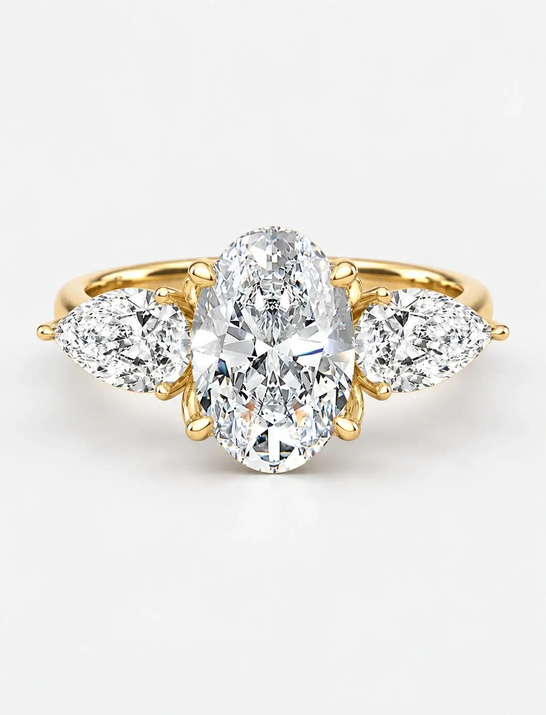 IGI Certified Lab Grown Oval Cut Three-Stone Diamond Engagement Ring with Pear Side Stones in Gold & Platinum