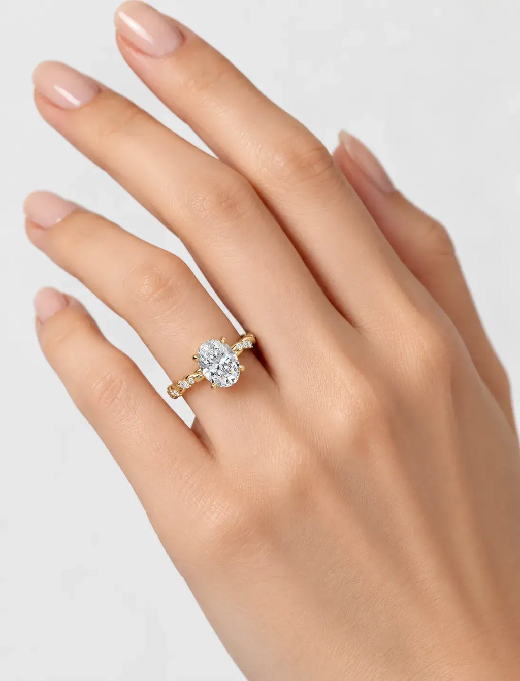 IGI Certified Lab Grown Oval Cut Solitaire Engagement Ring with a Twisted Pavé Band in Gold & Platinum