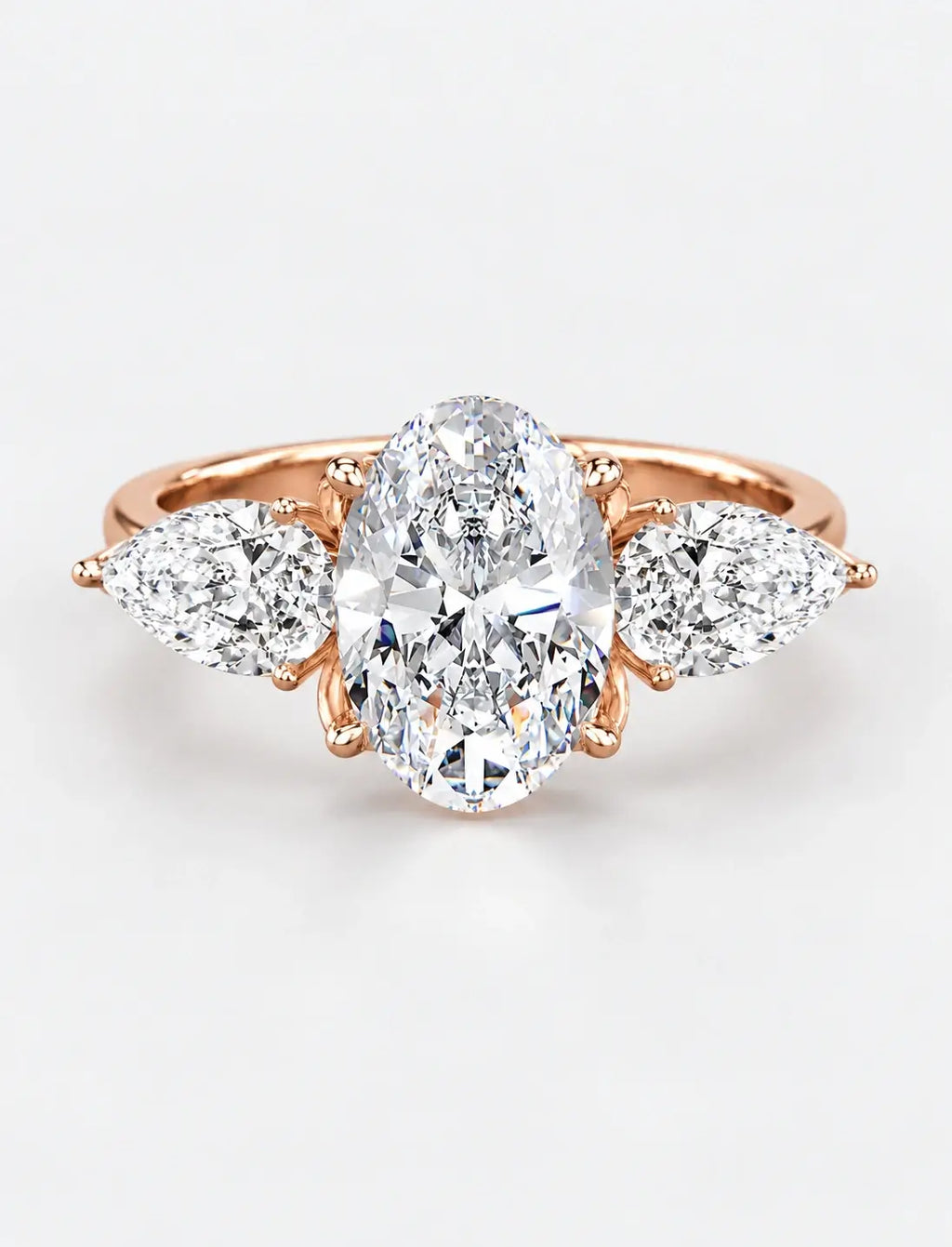 IGI Certified Lab Grown Oval Cut Three-Stone Diamond Engagement Ring with Pear Side Stones in Gold & Platinum