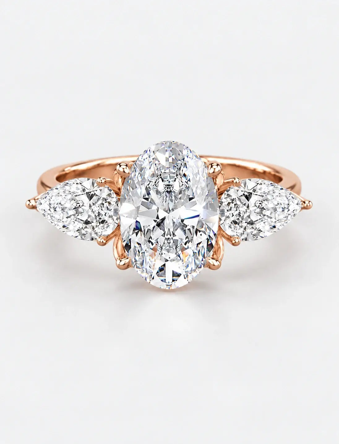 IGI Certified Lab Grown Oval Cut Three-Stone Diamond Engagement Ring with Pear Side Stones in Gold & Platinum