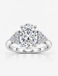 Oval-Cut Diamond Engagement Ring with Cluster Side Stones in Gold & Platinum