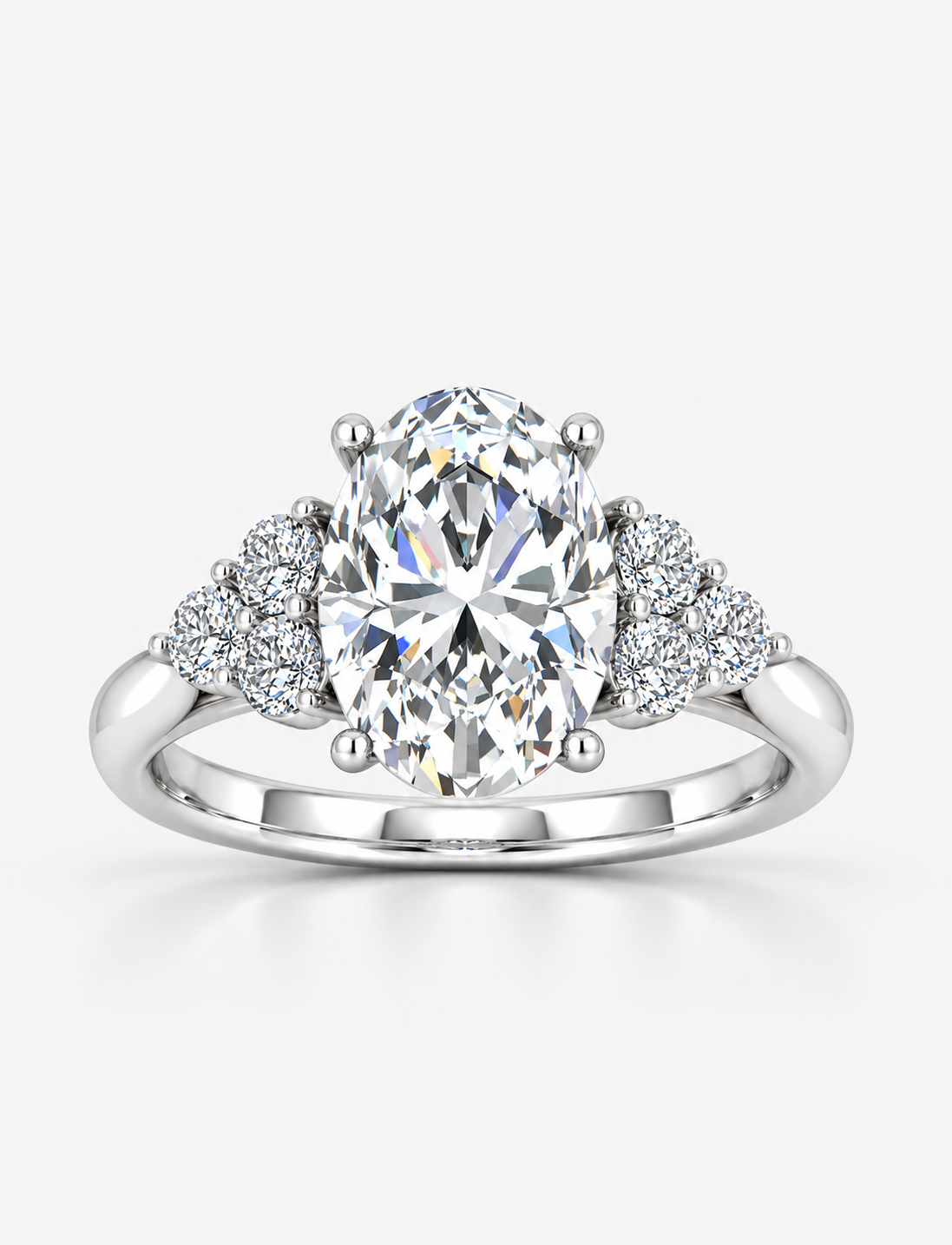 Oval-Cut Diamond Engagement Ring with Cluster Side Stones in Gold & Platinum