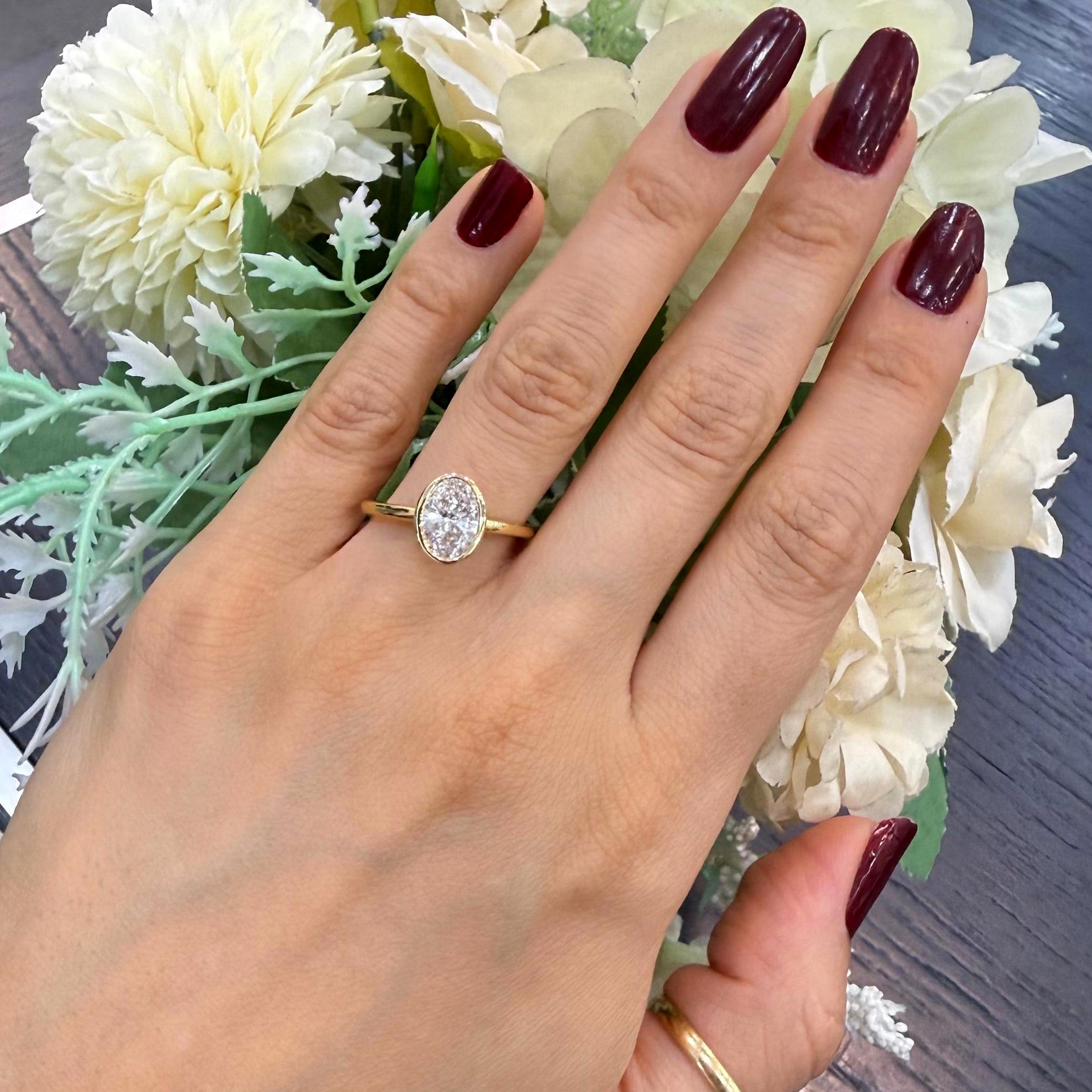 IGI 1.40ct E/VS Oval Lab Diamond Bezel Set Solitaire Ring In 18k Yellow Gold